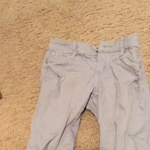 Some gray jeans and a purple skirt causal